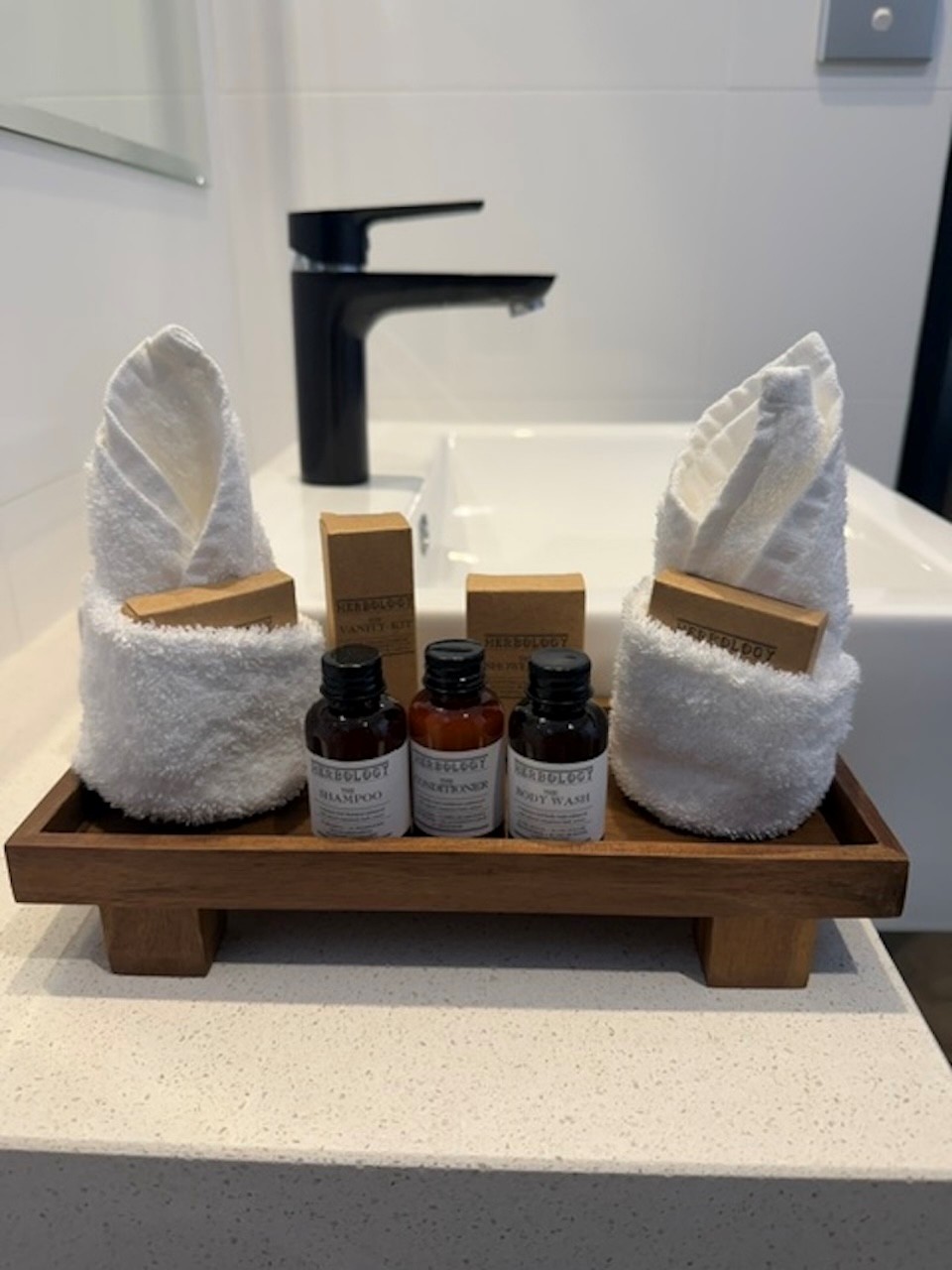 Bathroom vanity with fresh towels and toiletries